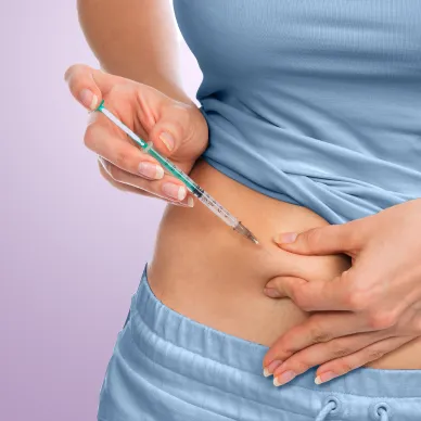 A close up of a person injecting themselves with a GLP-1 medication.